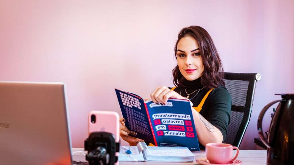 Woman reading a book at a desk
